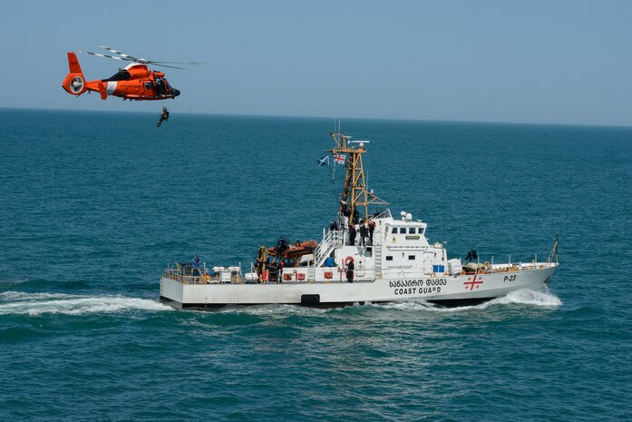 210503-G-ID129-1107 BLACK SEA (May 3, 2021) U.S Coast Guard MH-65 Dolphin helicopter crew conduct hoisting evolutions with Georgian coast guard vessel Dioskuria (P-25) and Ochamchire (P-23) in the Black Sea, May 3, 2021. Hamilton is on a routine deployment in the U.S. Sixth Fleet area of operations in support of U.S. national interests and security in Europe and Africa. (U.S. Coast Guard photo by Petty Officer 3rd Class Sydney Phoenix)