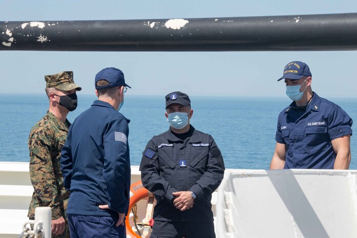 210503-G-G0108-1049 BLACK SEA (May 3, 2021) USCGC Hamilton (WMSL 753) welcomes a Georgian coast guard member aboard for a boat tour in the Black Sea, May 3, 2021. Hamilton is on a routine deployment in the U.S. Sixth Fleet area of operations in support of U.S. national interests and security in Europe and Africa. (U.S. Coast Guard courtesy photo)