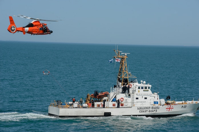 210503-G-ID129-1088 BLACK SEA (May 3, 2021) U.S Coast Guard MH-65 Dolphin helicopter crew conduct hoisting evolutions with Georgian coast guard vessel Dioskuria (P-25) and Ochamchire (P-23) in the Black Sea, May 3, 2021. Hamilton is on a routine deployment in the U.S. Sixth Fleet area of operations in support of U.S. national interests and security in Europe and Africa. (U.S. Coast Guard photo by Petty Officer 3rd Class Sydney Phoenix)