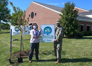U.S. Army Col. Edward Vedder, Joint Base Langley-Eustis installation vice commander and Alicia Garcia, 633rd Civil Engineer Squadron installation management flight-environmental element natural resources program manager, pose for a photo after an Arbor Day celebration at JBLE, Virginia, April 23, 2021.