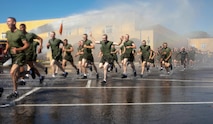 New Marines with Fox Company, 2nd Recruit Training Battalion, participate in a motivational run at Marine Corps Recruit Depot, San Diego, April 28, 2021.