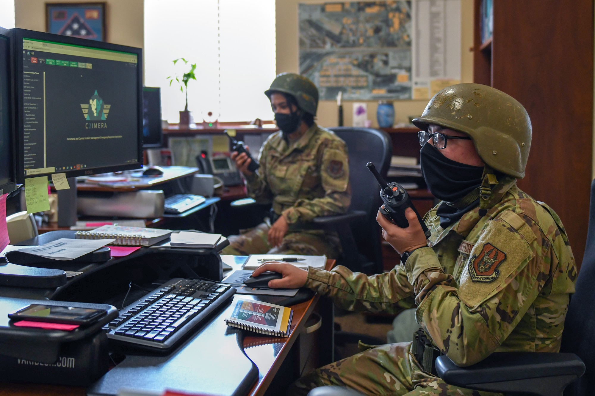 Airman Nicole Corp and Senior Airman Gabriela Knudson, command support staff reservists in the 419th Maintenance Group, relay information to other squadrons and flights during an exercise May 1, 2021 at Hill Air Force Base, Utah.