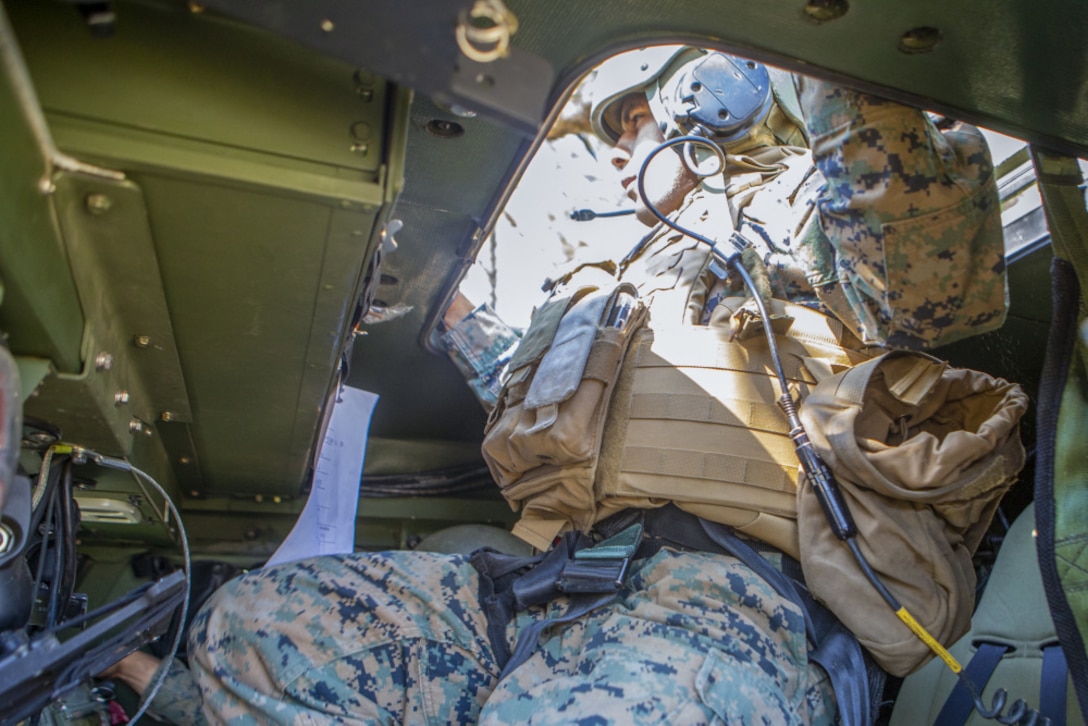 U.S. Marine Corps Staff Sgt. Jonathan Gonzalezcruz, a native of Brooklyn, N.Y., and a field artillery cannoneer with 1st Battalion, 10th Marine Regiment, 2nd Marine Division, exits a High Mobility Artillery Rocket System during Exercise Rolling Thunder 21.2 on Fort Bragg, N.C., April 26, 2021. This is a live-fire artillery exercise where 10th Marines employed distributed fires via simulated Expeditionary Advanced Bases. The training increased 2nd MARDIV’s combat readiness against a peer competitor. HIMARS are an advanced long-range and mobile rocket system that allowed 2nd MARDIV to employ precision fires onto a target.