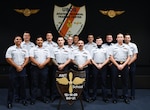 Graduates of aviation maintenance technician school class 166-21, gather to celebrate completing their initial schooling in the Coast Guard, Dec. 22, 2020 at Elizabeth City, North Carolina. Shown are (back row left to right) Petty Officers 3rd Class Reece A. Williams, Hunter G. Morris, Christopher J. Pavlik, Darien T. Neely, Shea C. Erickson, Herbert A. Pitts, and Patrick R. Brown, and (front row, left to right), Petty Officers 3rd Class Hadi Yaagoubi, Jordan E. Sanchez, Ryley K. Smith, Christian D. Mirenda, Kayle W. Bosley, and James T. Carabin. The first class to graduate using the RAP program.