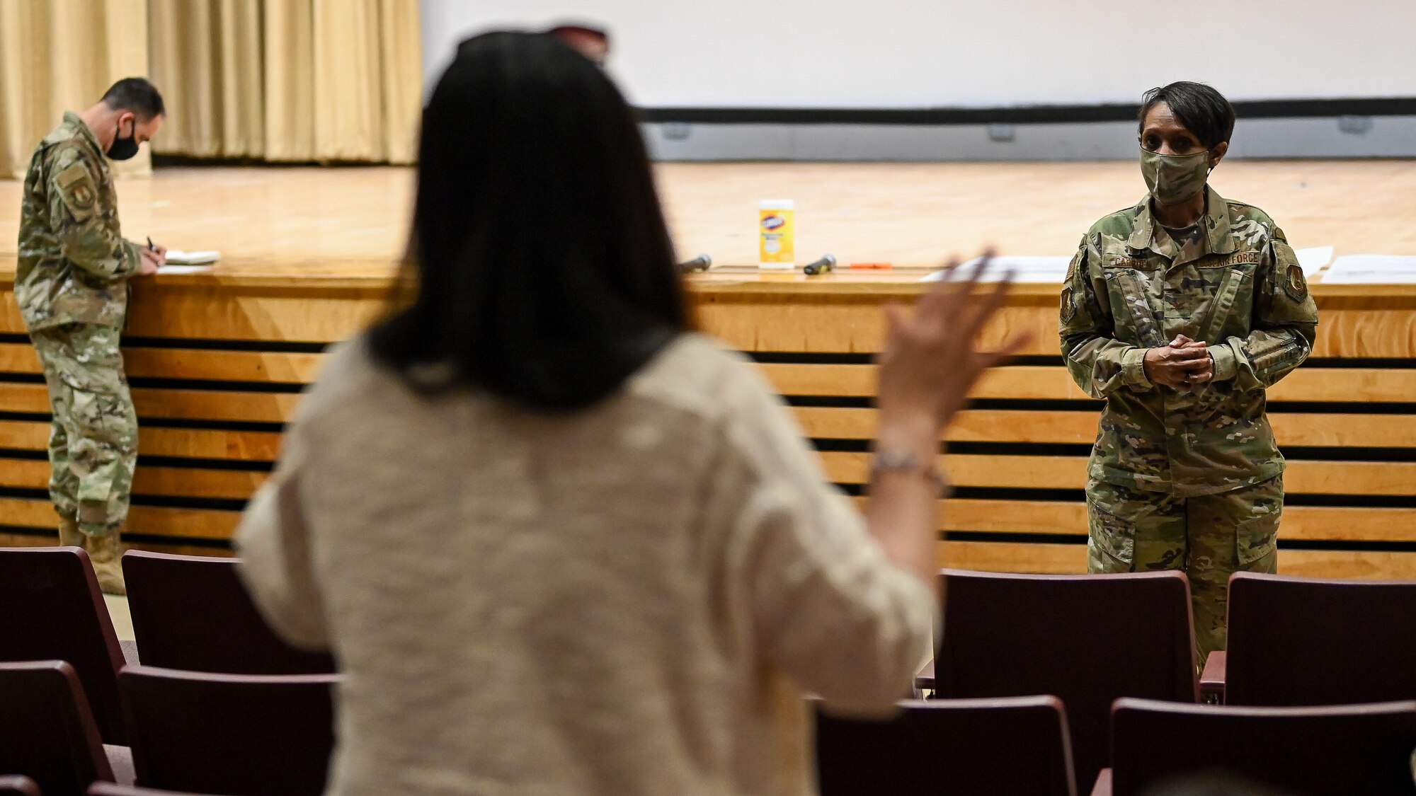 Col. Carroll listens to a question from a base resident.