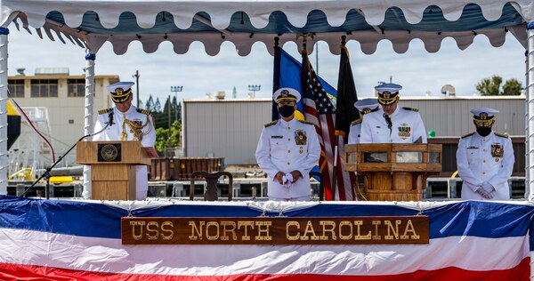 Cmdr. Steven Stougard, chaplain, Naval Submarine Service Center, gives the benediction during the change of command ceremony for Commander, Submarine Force, U.S. Pacific Fleet, held on the brow of the Virginia-class fast-attack submarine USS North Carolina (SSN 777).