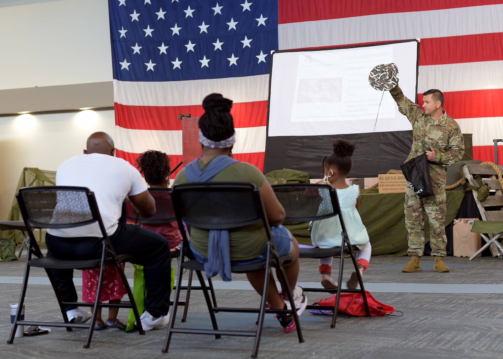 Airman briefing kids at event