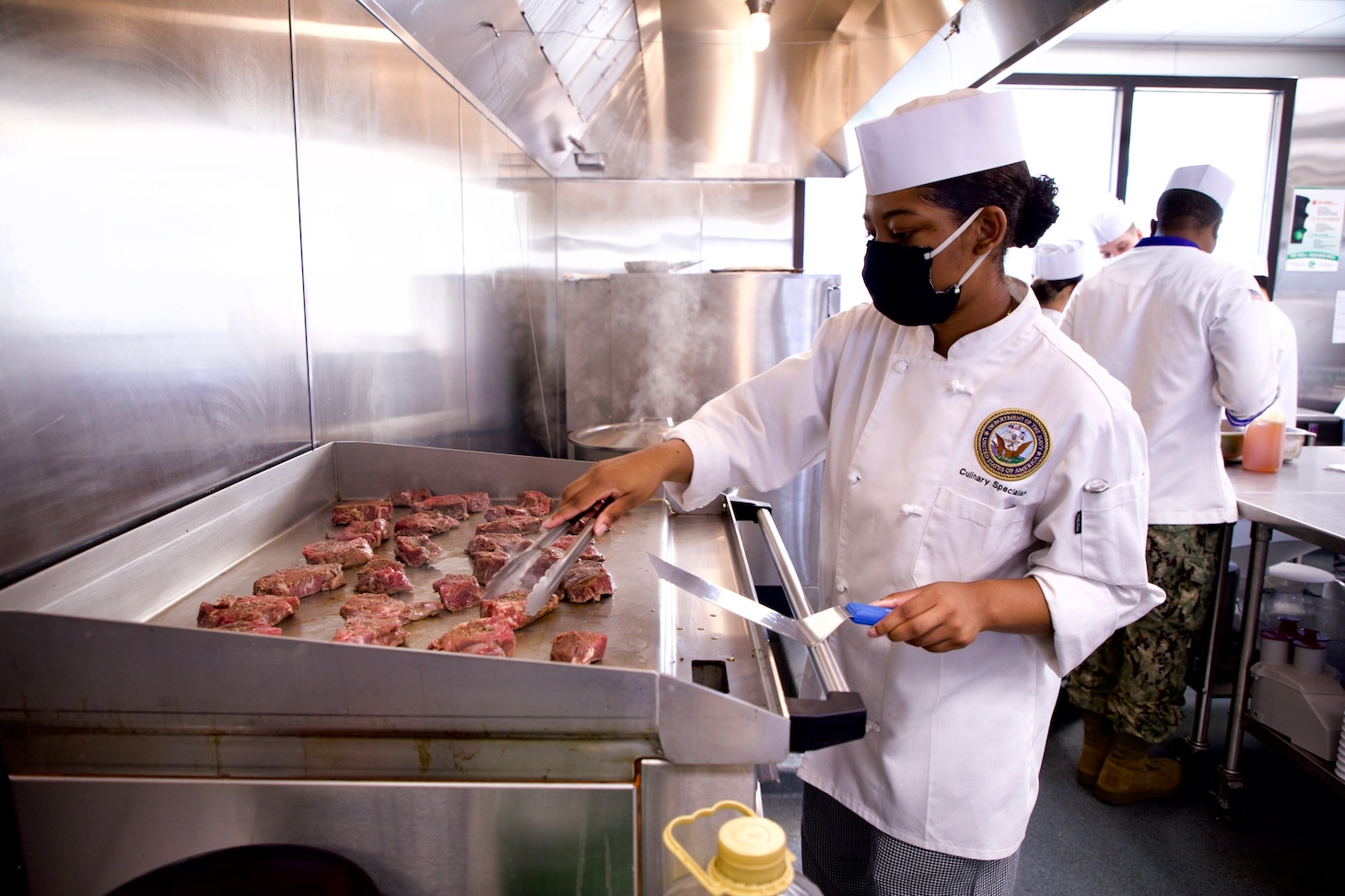 A Sailor assigned the the Freedom-variant littoral combat ship USS Sioux City (LCS 11) prepares beef tenderloin steaks while taking part in a week-long course on baking and scratch cooking techniques. After a year of closure due to the COVID-19 pandemic, culinary specialists returned to the Naval Supply Systems Command (NAVSUP) Fleet Logistics Center (FLC) Jacksonville training galley at Naval Station Mayport.