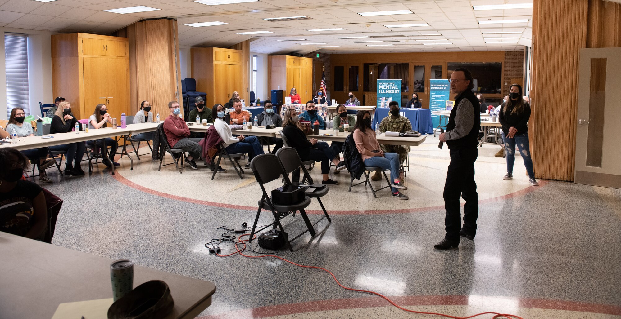 Man speaks to event attendees