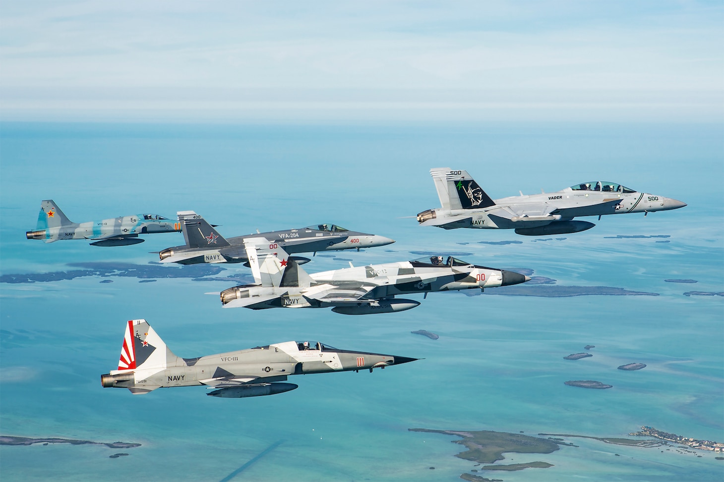 KEY WEST, Fla. (Feb. 4, 2021) Aircraft representing each of the Navy Reserve's five Tactical Support Wing (TSW) squadrons fly near Key West prior to a training exercise. The TSW aircraft were in Key West to support training for Electronic Attack Squadron (VAQ) 209 and Fighter Attack Squadron (VFA) 106. (U.S. Navy photo by Commander Peter Scheu/Released)