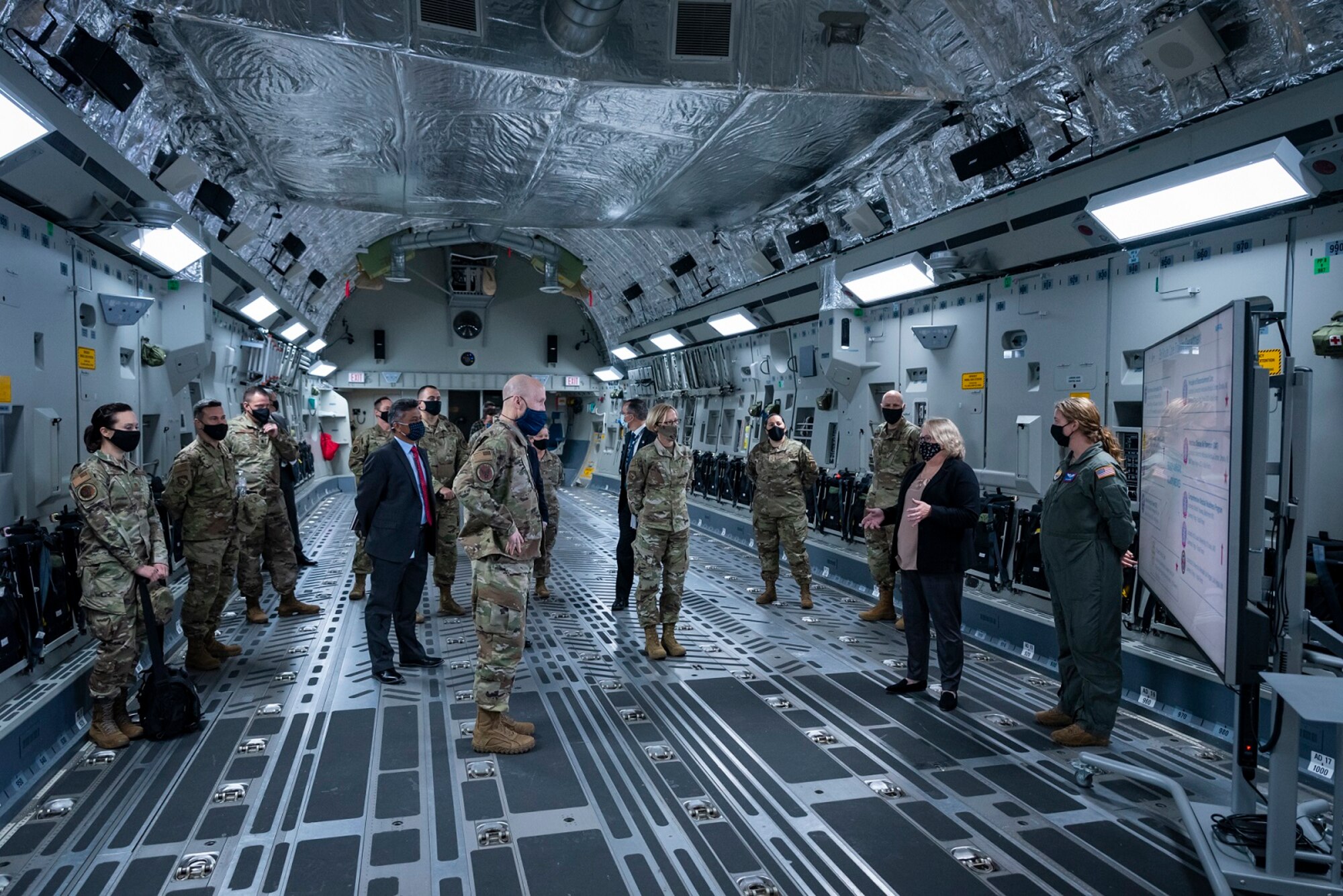 Elizabeth Miller, En Route Care Training Department Deputy Chair at the USAF School of Aerospace Medicine, speaks to Gen. David Allvin, Air Force Vice Chief of Staff in a C-17 trainer during his visit to AFRL's 711th Human Performance Wing Apr. 26, 2021 at Wright-Patterson Air Force Base, Ohio. Allvin was briefed on Ready Medics and Aeromedical Evacuation training. (U.S. Air Force photo/Richard Eldridge)