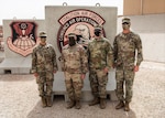 Members of the 130th Field Artillery Brigade  who participated in the Air and Missile Defense Exercise 21 pose for a photo at the Combined Air Operations Center in Souwthwest Asia. From right to left: Chief warrant officer Carol Sprawka, brigade targeting officer; Sgt. Evan Andrews, fire direction non-commissioned officer; Capt. Daniel Vancil, space operations officer; and Maj. Chris Koochel, CAOC liaison officer. 

AMDEX 21 contributes to the increased lethality and readiness within the Task Force Spartan area of responsibility. Task Force Spartan is committed to establishing strong partnerships and maintaining a ready and responsive force.