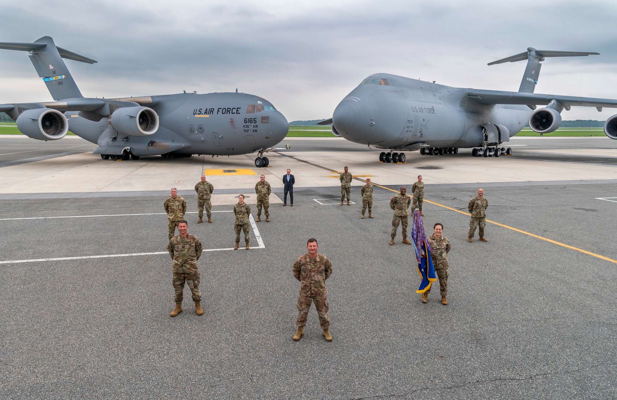 Leadership from the 436th Airlift Wing, Dover Air Force Base, Delaware, take a group photo Sept. 11, 2020, on the flight line at Dover AFB. The 436th AW operates the C-17 Globemaster III and C-5M Super Galaxy aircraft. (U.S. Air Force photo by Senior Airman Christopher Quail)