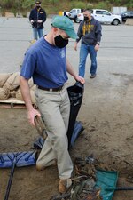 210430-N-EJ843-0100 GROTON, Conn. (April 30, 2021) Naval Submarine Base (SUBASE) New London Commanding Officer Capt. Todd Moore and Naval Submarine School (SUBSCOL) Executive Officer Cmdr. Karl Hassenfratz participates in base wide clean-up onboard Naval Submarine Base (SUBASE) New London. SUBSCOL was one of many commands to help during a volunteer event focused on environmental cleanliness to recognize Earth Day. (U.S. Navy photo by Mass Communications Specialist Seaman Jimmy Ivy III/Released)