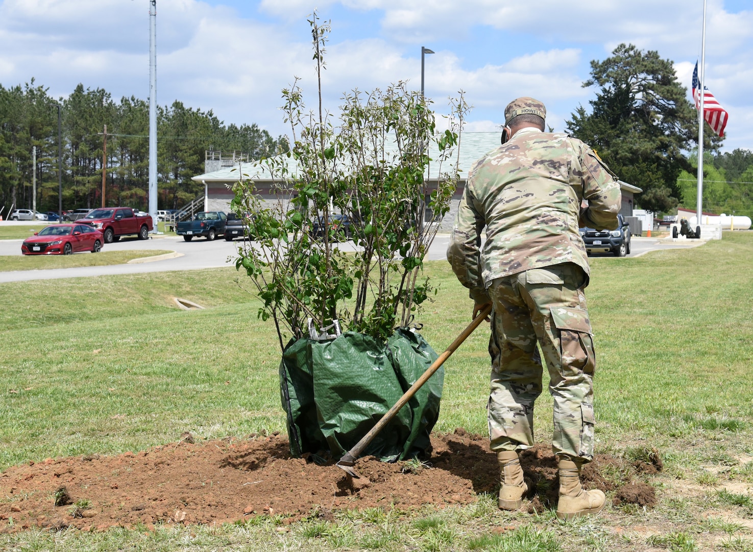 Virginia National Guard Soldiers and civilian employees of Maneuver Training Center Fort Pickett plant two trees at the MTC garrison headquarters in honor of Earth Day April 22, 2021, at Fort Pickett, Virginia.