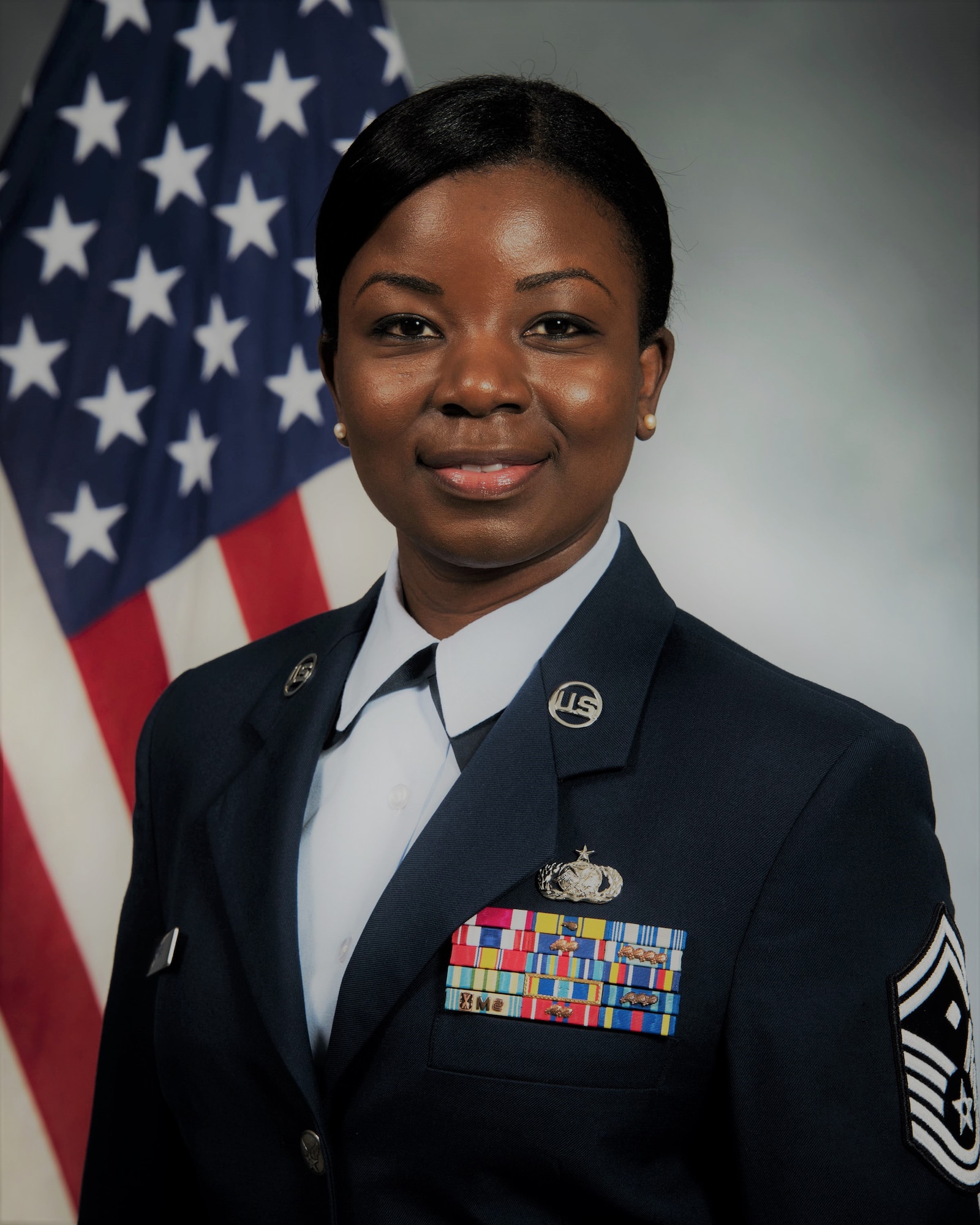 woman posing in front of a flag