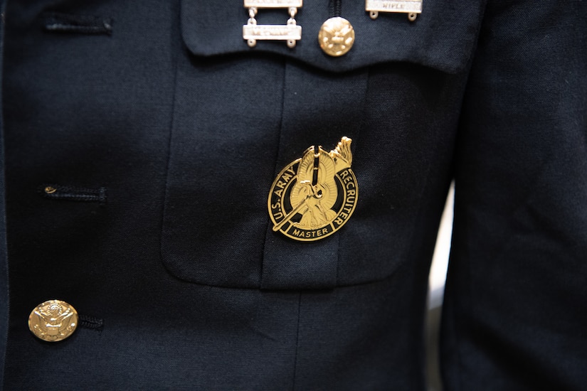 photos of an army badge and group of Soldiers receiving their badge.