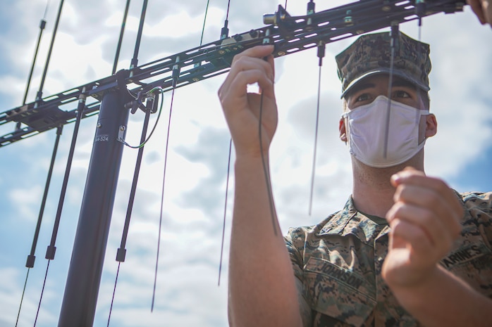 U.S. Marine Corps Lance Cpl. Joshua Johnson, a ground electronics transmission systems maintainer with 1st Radio Battalion, I Marine Expeditionary Force Information Group, assembles the new Increment II (Inc II) Core System antenna during training at Marine Corps Base Camp Pendleton, California, March 23, 2021. The Inc II Core System and Back-Packable Kit are new fielding systems for the Communications Emitter Sensing and Attacking System II that will allow Marines to detect, deny and disrupt threat communications. (U.S. Marine Corps photo by Lance Cpl. Aidan Hekker)