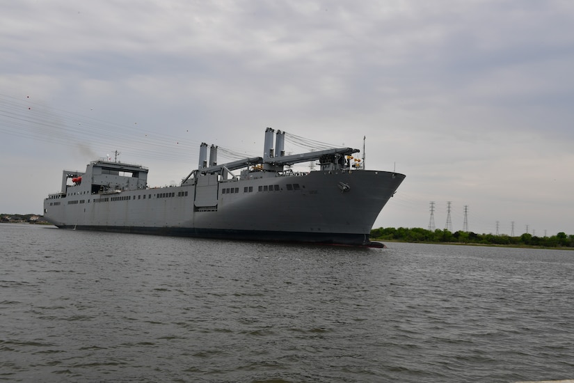 A large ship moves through the water.