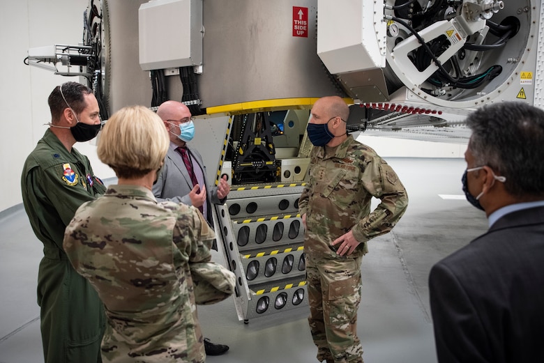Dr. David Burch, Airman Systems Directorate's Airman Biosciences Division, Lt. Col. Nathan Maertens, Aerospace Physiology Division Chief at the USAF School of Aerospace Medicine, Air Force Research Laboratory commander, Brig. Gen. Heather Pringle and Dr. Rajesh Naik, 711th Human Performance Wing Chief Scientist stand in front of the centrifuge and discuss aerospace physiology partnerships with Gen. David Allvin, Air Force Vice Chief of Staff, during his visit to AFRL's 711 HPW Apr. 26, 2021 at Wright-Patterson Air Force Base, Ohio. (U.S. Air Force photo/Richard Eldridge)