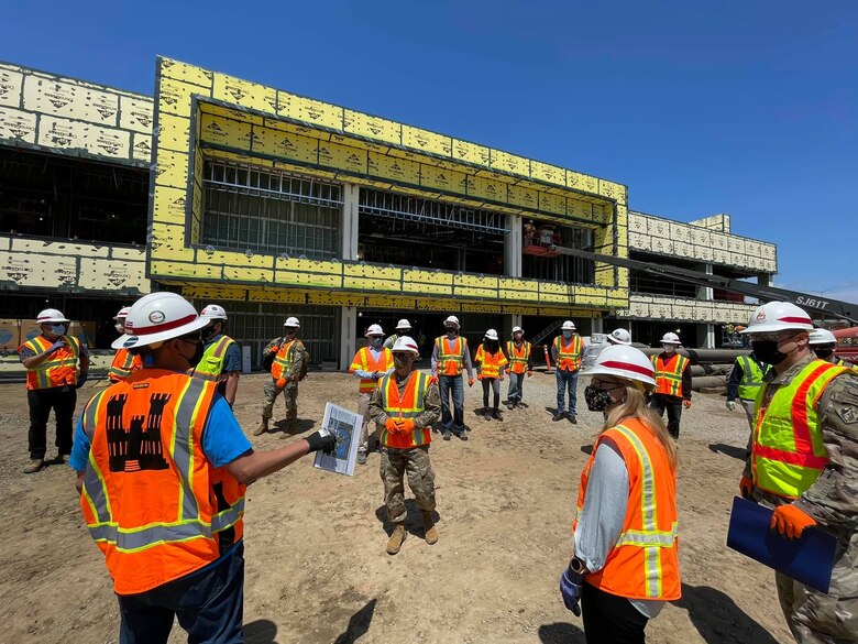 Maj. Gen. Jeffrey Milhorn, deputy commanding general for military and international operations for the U.S. Army Corps of Engineers, center, receives a brief about the U.S. Department of Veterans Affairs VA Long Beach Healthcare System medical complex April 27 in Long Beach, California.