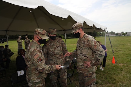 (Left) U.S. Air Force Maj. Gen. Ricky Rupp, Air Force District of Washington commander, speaks with Col. Mike “Goose” Zuhlsdorf, 11th Wing commander, and Lt. Col. Ryan LeBlanc, 11th Civil Engineer Squadron commander, during the LEARN ground breaking ceremony at  Joint Base Anacostia-Bolling, Washington D.C., April 29, 2021. LEARN D.C. is a new public charter school located on JBAB and open to all D.C. children in Fall 2021.