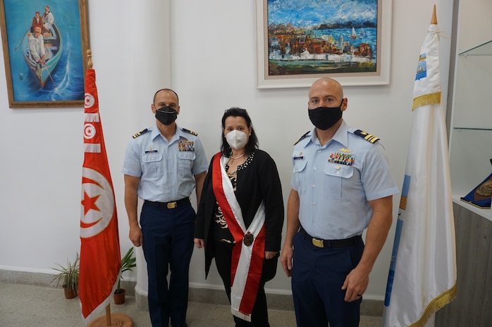 Lt. Cmdr. Samuel Blase (left), USCGC Robert Goldman (WPC 1142), and Lt. Cmdr. Steve Hulse (right), USCGC Charles Moulthrope (WPC 1141) with the Mayor of La Goulette, Tunisia, Ms. Amel Limam, upon arrival April 22, 2021. Charles Moulthrope and Robert Goldman are en route to their new homeport in Bahrain in support of the Navy’s U.S. Fifth Fleet and U.S. Coast Guard Patrol Forces Southwest Asia.