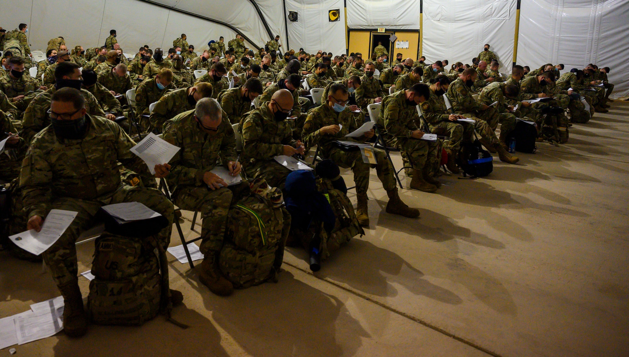 Airmen from South Carolina Air National Guard’s 169th “Swamp Fox” Fighter Wing in-process at Prince Sultan Air Base, Kingdom of Saudi Arabia, April 12, 2021. The Swamp Fox team has been deployed to PSAB to help bolster the defensive capabilities against potential threats in the region. (U.S. Air Force Photo by Senior Airman Samuel Earick)