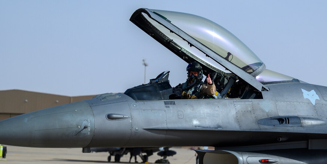 Lt. Col. Zach Counts, 157th Expeditionary Fighter Squadron pilot, gives a thumbs up after landing the U.S. Air Force F-16CJ Fighting Falcon at Prince Sultan Air Base, Kingdom of Saudi Arabia, April 14, 2021. The squadron deployed to PSAB from South Carolina Air National Guard’s 169th “Swamp Fox” Fighter Wing to help bolster the defensive capabilities against potential threats in the region. (U.S. Air Force Photo by Senior Airman Samuel Earick)
