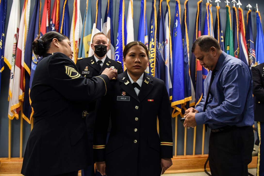 Nine Virginia Army National Guard officer candidates celebrate their graduation from Officer Candidate School April 25, 2021, at a ceremony held at Fort Pickett, Virginia. The candidates, all part of the winter accelerated Class 64A, took the oath of office and were then pinned with second lieutenant rank by family and friends. Col. Doyle Gillis, the Virginia National Guard’s director of manpower and personnel, served as the guest speaker. (U.S. Army National Guard photo by Sgt. 1st Class Terra C. Gatti)