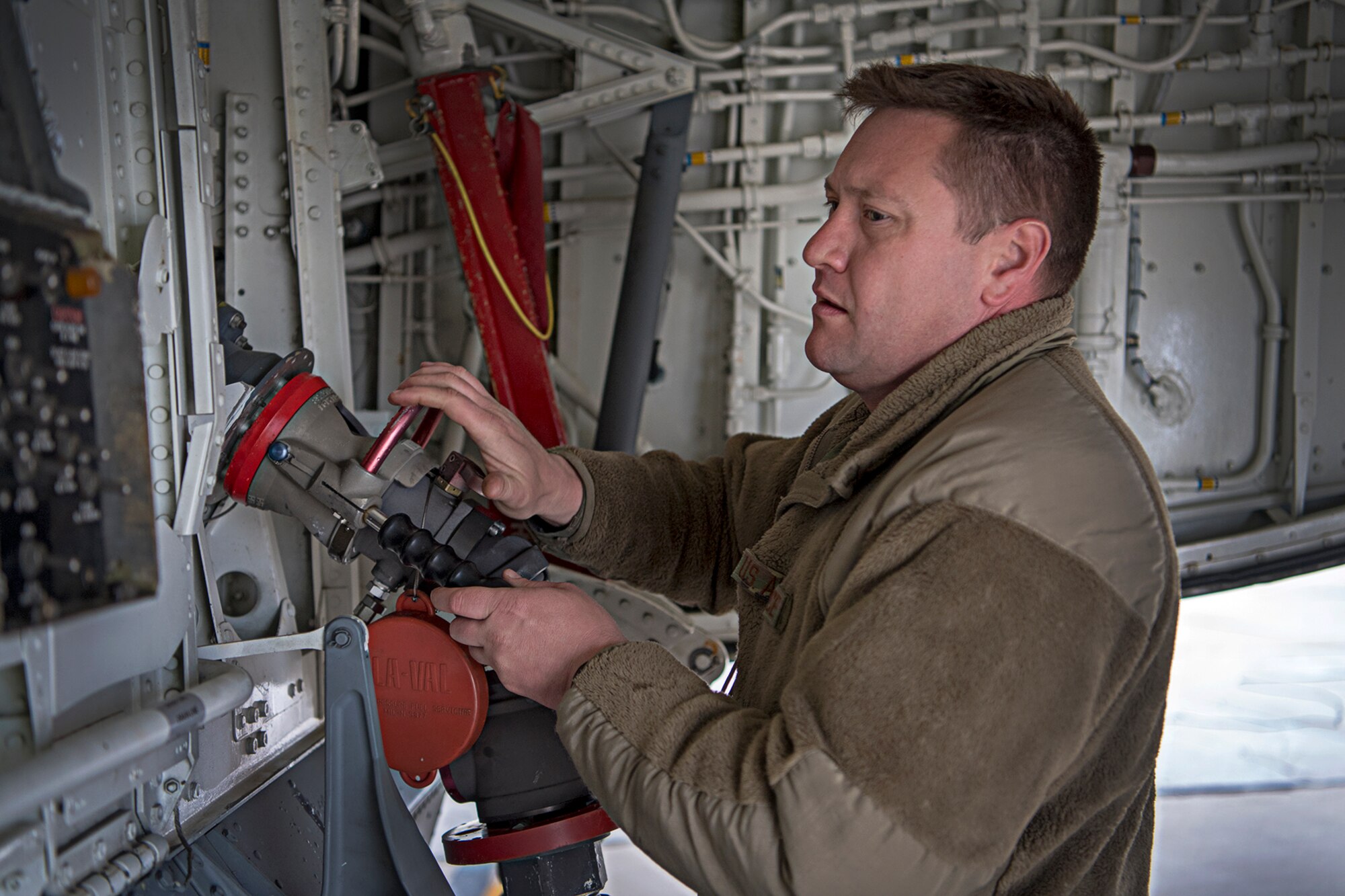 Tech. Sgt. Jason Jessup, 434th Maintenance Squadron, hooks a hose to a Grissom KC-135R Stratotanker to pump fuel on board. A $35 million Type III fuel hydrant system became operational at Grissom fueling unit capabilities into the future. (U.S. Air Force photo/Douglas Hays)