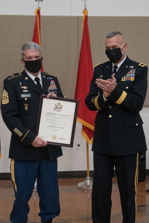 Soldiers pose with certificate