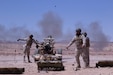 QRF Brigade field artillery gun crew fire the M119A2 105mm Howitzer at the Al Quwayrah Training Area, Jordan. The artillery gun crew, a mortar crew, and Jordanian Royal Marines participated in live fire exercise over the course of a week.