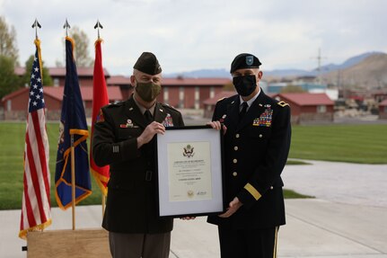 Soldiers pose with certificate