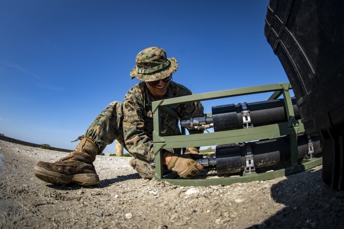 Lance Cpl. Daniel Bordenave, a water support technician with Special Purpose Marine Air-Ground Task Force - Southern Command, sets up a lightweight water purification system during a command post exercise at Camp Lejeune, N.C., April 8, 2020. Water support technician Marines used lightweight water purification systems to purify water before providing it to the combat engineer Marines working at another site. The CPX increases readiness and challenges SPMAGTF-SC command and control, communications and timely decision-making capabilities through simulated real-world scenarios. SPMAGTF-SC will be deployed into the Southern Command area of operation to provide crisis response preparedness efforts, security cooperation training and engineering events to help strengthen relations with partner nations throughout Central and South America. Bordenave is from Pleasanton, California.