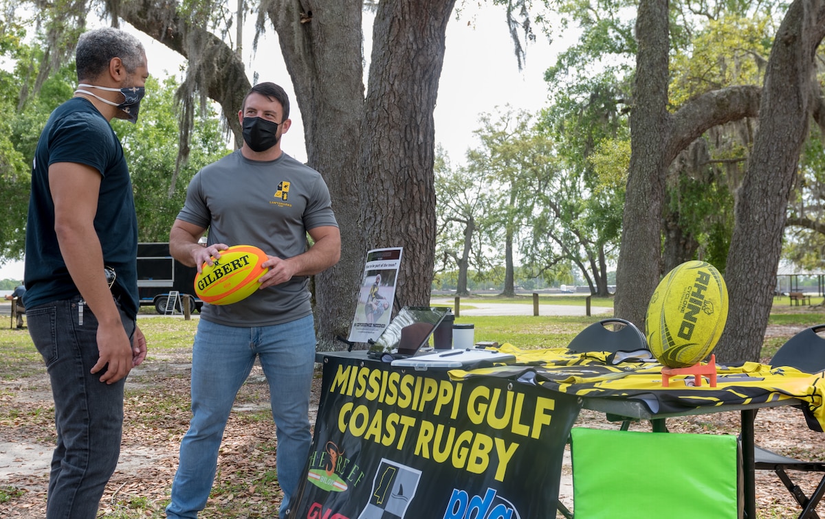 Kenneth Leggett, 85th Engineering Installation Squadron engineer and Rugby Club president briefs Alton Richards, 85th EIS electronics engineer, on the Mississippi Gulf Coast Rugby Club opportunities during the Keesler Club Day event at the Marina Park at Keesler Air Force Base, Mississippi, April 29, 2021. The event consisted of a variety of clubs offering information about the benefits they have to offer Keesler personnel and their families. (U.S. Air Force photo by Andre' Askew)