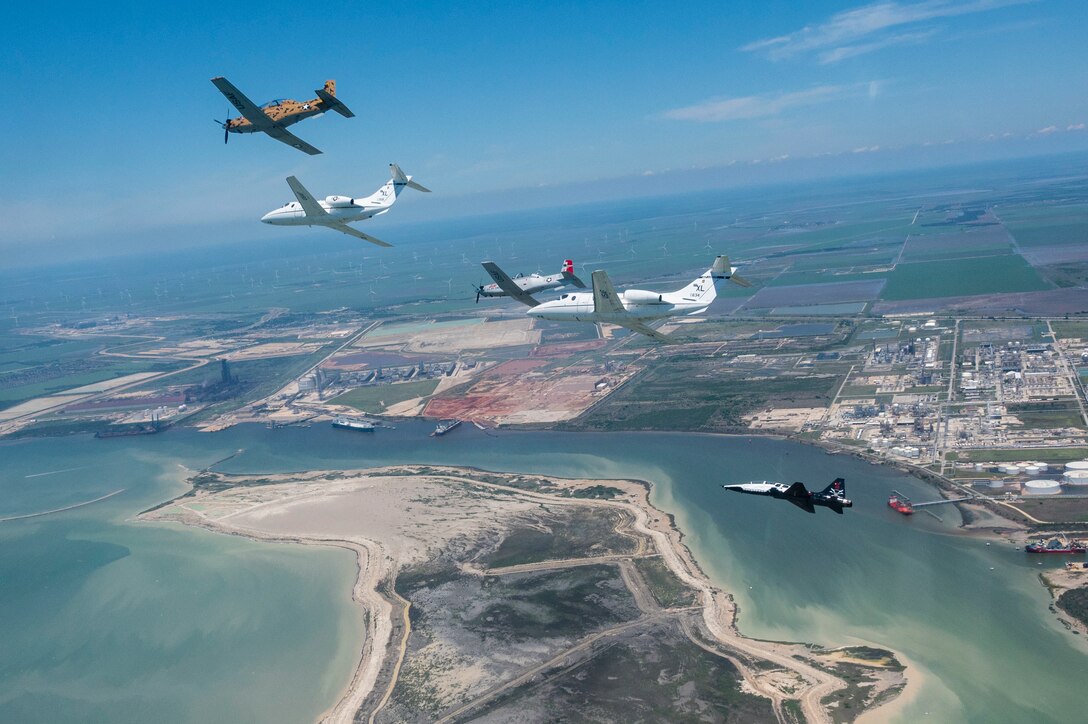A six-ship dissimilar formation consisting of two T-1A Jayhawks, two T-38 Talons, and two T-6A Texan II aircrafts from Laughlin Air Force Base, Texas, practice advanced maneuvering May, 2, 2021. Instructor pilots from the 434th, 87th and 85th Flying Training Squadrons demonstrated the flying proficiency all Air Force student pilots receive during their 52-week Specialized Undergraduate Pilot Training, before being assigned their operational career airframe. (U.S. Air Force photo by Airman 1st Class David Phaff)