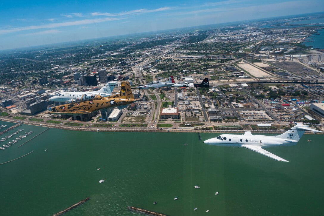 A six-ship dissimilar formation consisting of two T-1A Jayhawks, two T-38 Talons, and two T-6A Texan II aircrafts from Laughlin Air Force Base, Texas, practice advanced maneuvering May, 2, 2021. Instructor pilots from the 434th, 87th and 85th Flying Training Squadrons demonstrated the flying proficiency all Air Force student pilots receive during their 52-week Specialized Undergraduate Pilot Training, before being assigned to their operational career airframe. (U.S. Air Force photo by Airman 1st Class David Phaff)