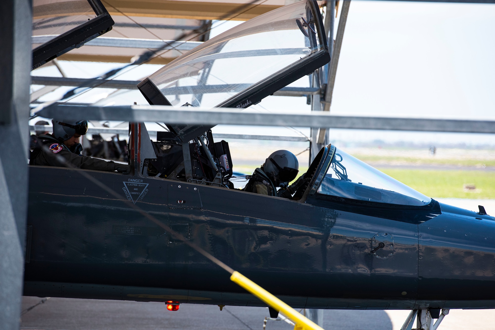 Two T-36 pilots perform prechecks on their aircraft on May, 2, 2021 at Corpus Christi. The pilots were performing in the Wings Over South Texas air show and flew a  six-ship Dissimilar Formation (u.s. Air Force photo by Airman 1st Class David Phaff)