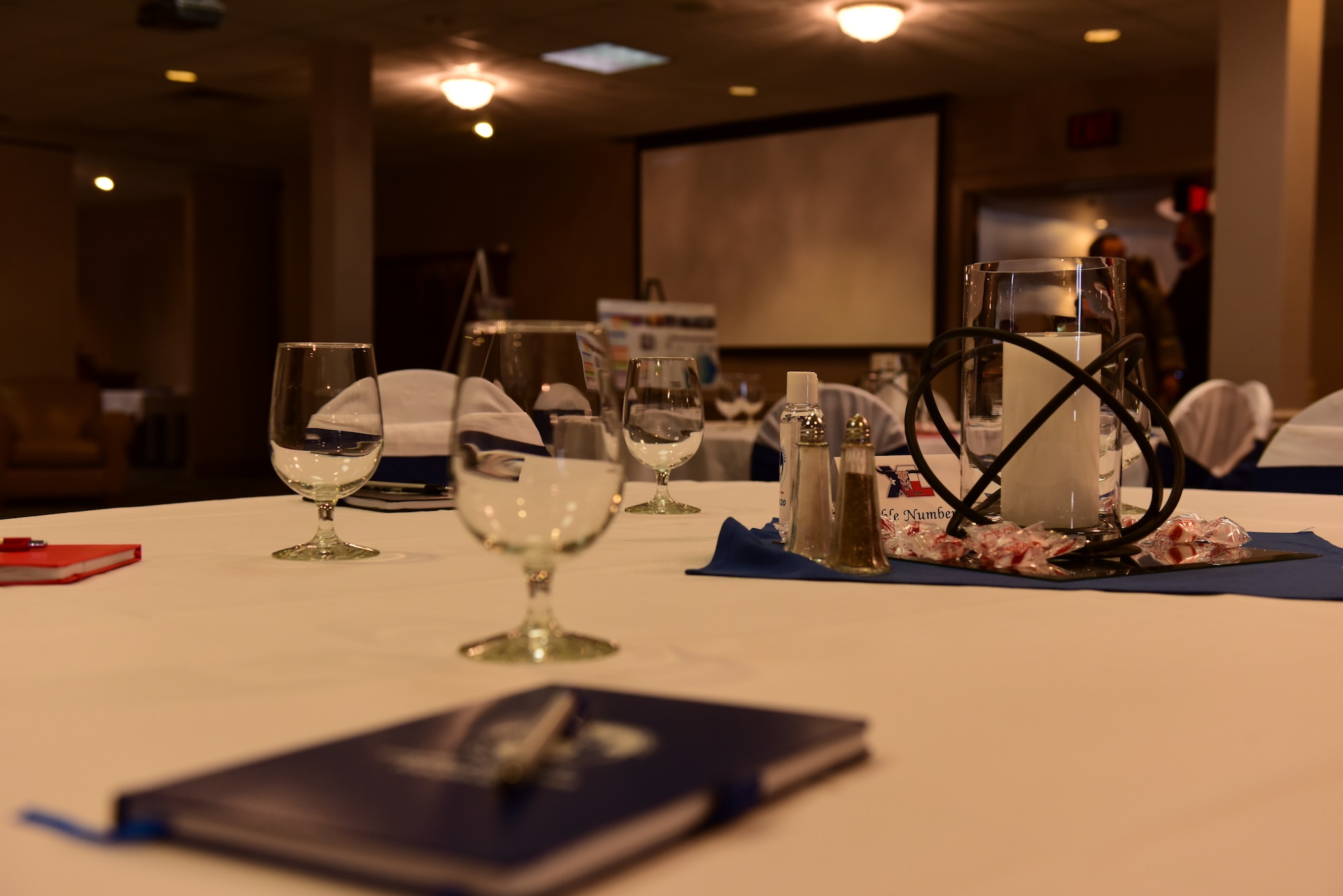A table awaits for attendees for the first ever address to Laughlin Air Force Base, Texas on Apr. 26th 2021. This is the first ever modern address to Laughlin the meeting was to forecast future base projects to the local community. (U.S. Air Force photo by Airman 1st Class David Phaff)