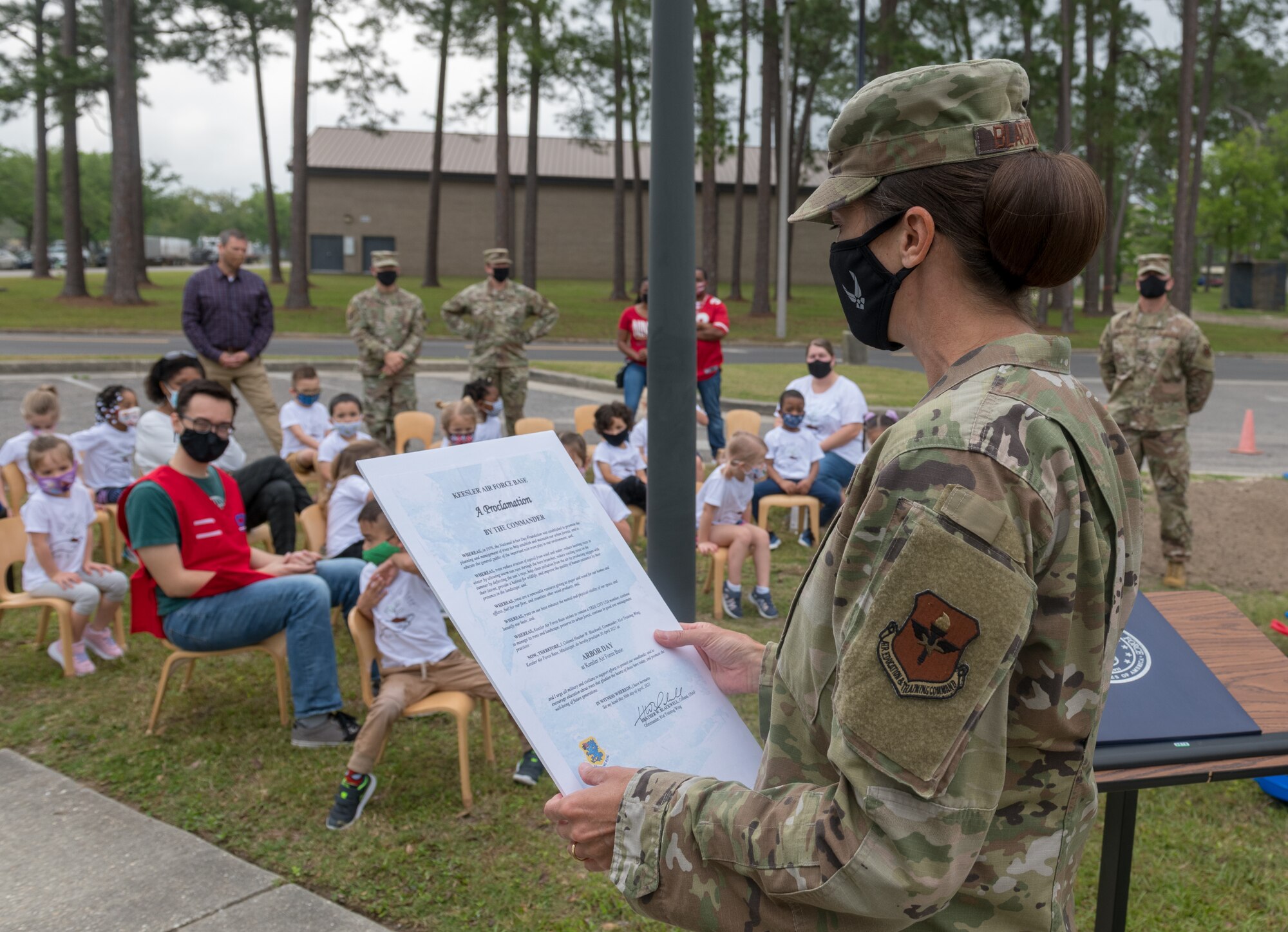 U.S. Air Force Col. Heather Blackwell, 81st Training Wing commander, reads the Arbor Day proclamation to a preschool class at the child development center during the Arbor Day Celebration at Keesler Air Force Base, Mississippi, April 30, 2021. A tree planting ceremony also took place at the event. (U.S. Air Force photo by Andre' Askew)