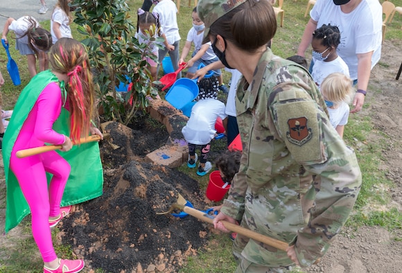 U.S. Air Force Col. Heather Blackwell, 81st Training Wing commander, plants a tree in honor of Arbor Day along with a preschool class at the child development center during the Arbor Day Celebration at Keesler Air Force Base, Mississippi, April 30, 2021. A proclamation was also read during the event. (U.S. Air Force photo by Andre' Askew)