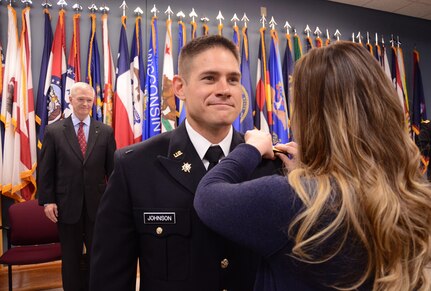 Second Lt. Abando A. Nkwanyou receives his lieutenant bars during a commissioning ceremony held April 29, 2018, at Fort Pickett, Virginia. (U.S. Army National Guard photo by Sgt. 1st Class Terra C. Gatti)