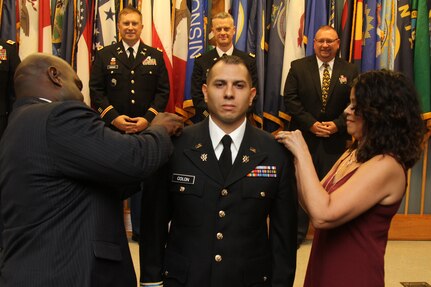 The Virginia Army National Guard welcomes 14 new lieutenants to its ranks with the commissioning of Officer Candidate School Class 60 and 61B Aug. 25, 2018, at Fort Pickett, Virginia. Class 60 was the traditional OCS program that runs nearly two years and taught by a cadre from the Fort Pickett-based 3rd Battalion, 183rd Regiment, Regional Training Institute, and Class 61B was the eight-week Accelerated OCS program at Fort McClellan, Alabama. The ceremony marked the end of a journey for the candidates as they took their oaths of office, received their OCS diplomas and their second lieutenant bars and delivered their first salute as new officers. (U.S. Army National Guard photo by Staff Sgt. Matt Lyman)