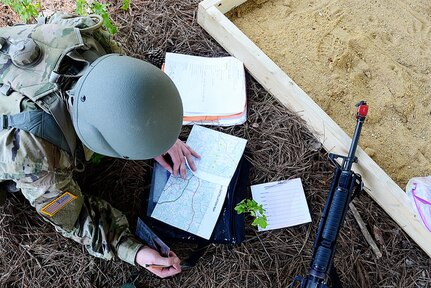 Approximately 30 National Guard officer candidates from Virginia, Delaware, Maryland, West Virginia and Washington, D.C., train together during a regional Field Level Exercise May 5, 2018, at Fort Pickett, Virginia. The exercise aimed to prepare the candidates for the third and final phase of Office Candidate School, which they will attend later this summer. (U.S. National Guard photo by Terra C. Gatti)