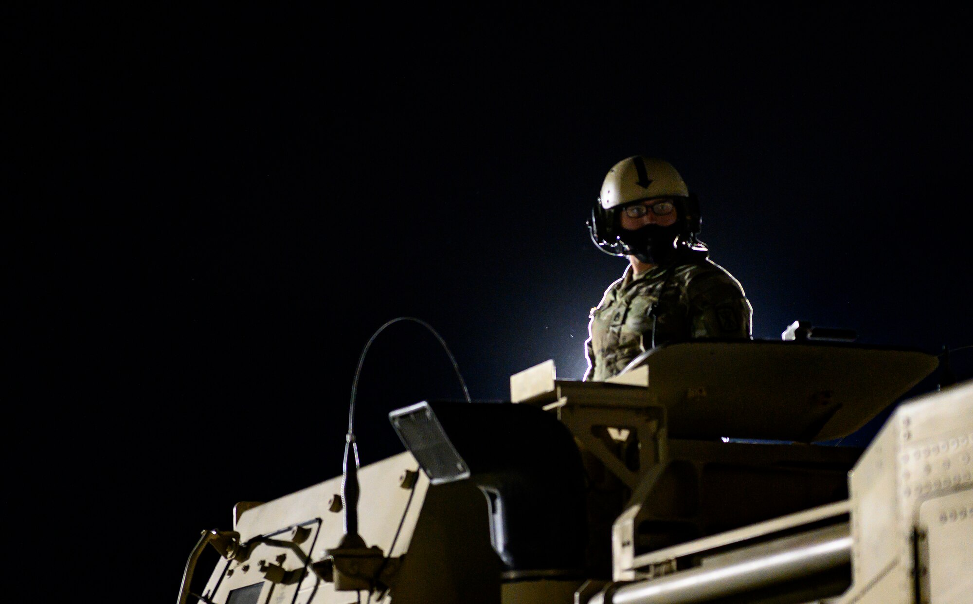 A U.S. Army Soldier waits for direction atop a High Mobility Artillery Rocket System April 27, 2021, at Mountain Home Air Force Base, Idaho. The HIMARS was used both as a simulated offensive capability as part of exercise Rainier War and as a means of training for various air mobility units who were able to familiarize the system’s configuration within cargo aircraft such as the C-17 Globemaster III. (U.S. Air Force photo by Staff Sgt. Christian Conrad)
