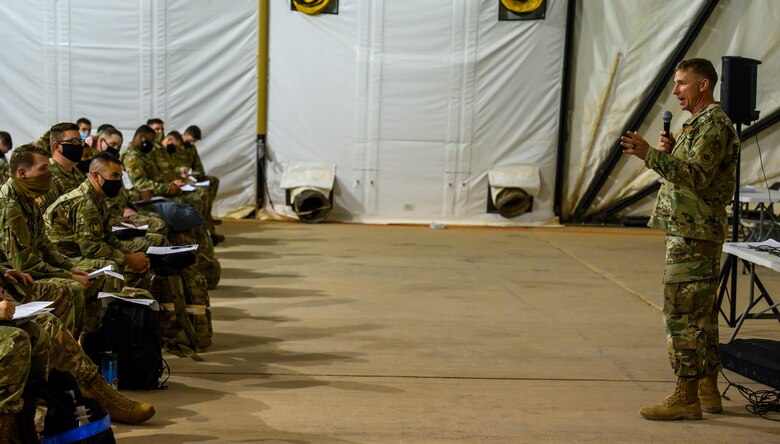 Brig. Gen. Evan Pettus, 378th Air Expeditionary Wing commander, welcomes new members of the wing at Prince Sultan Air Base, Kingdom of Saudi Arabia, April 12, 2021. Airmen from South Carolina Air National Guard’s 169th “Swamp Fox” Fighter Wing have been deployed to PSAB to help bolster the defensive capabilities against potential threats in the region. (U.S. Air Force Photo by Senior Airman Samuel Earick)