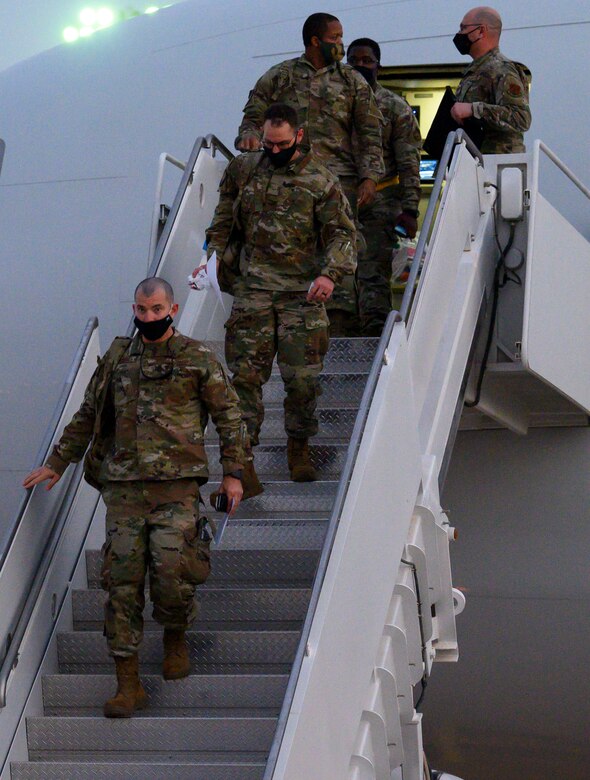 Members of South Carolina Air National Guard’s 169th “Swamp Fox” Fighter Wing leave the aircraft while arriving at Prince Sultan Air Base, Kingdom of Saudi Arabia, April 12, 2021. The Swamp Fox team has been deployed to PSAB to help bolster the defensive capabilities against potential threats in the region. (U.S. Air Force Photo by Senior Airman Samuel Earick)