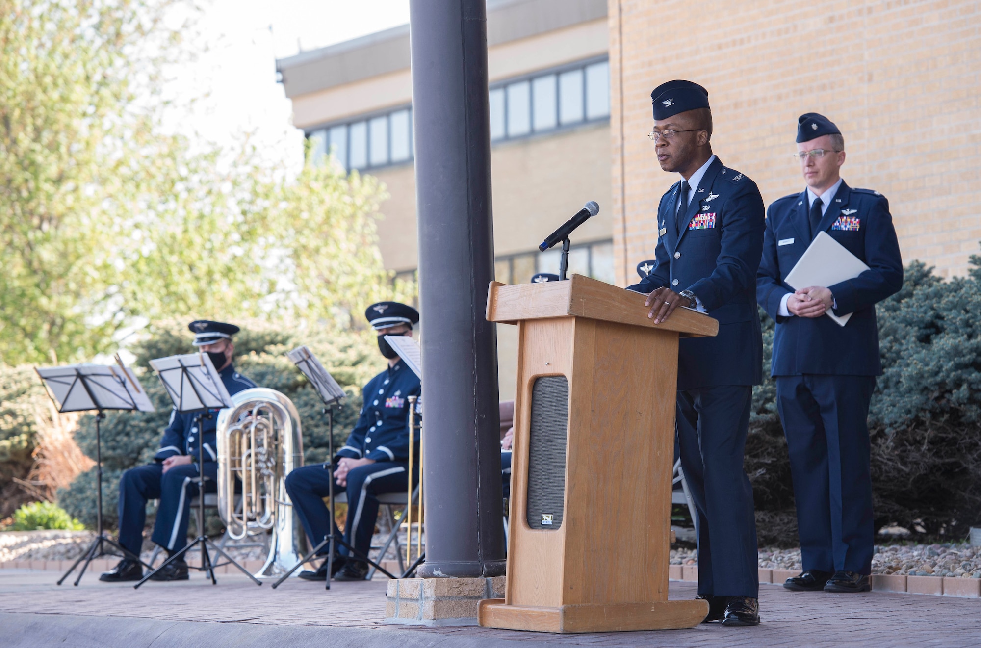 Man in uniform standing at podium giving a speech