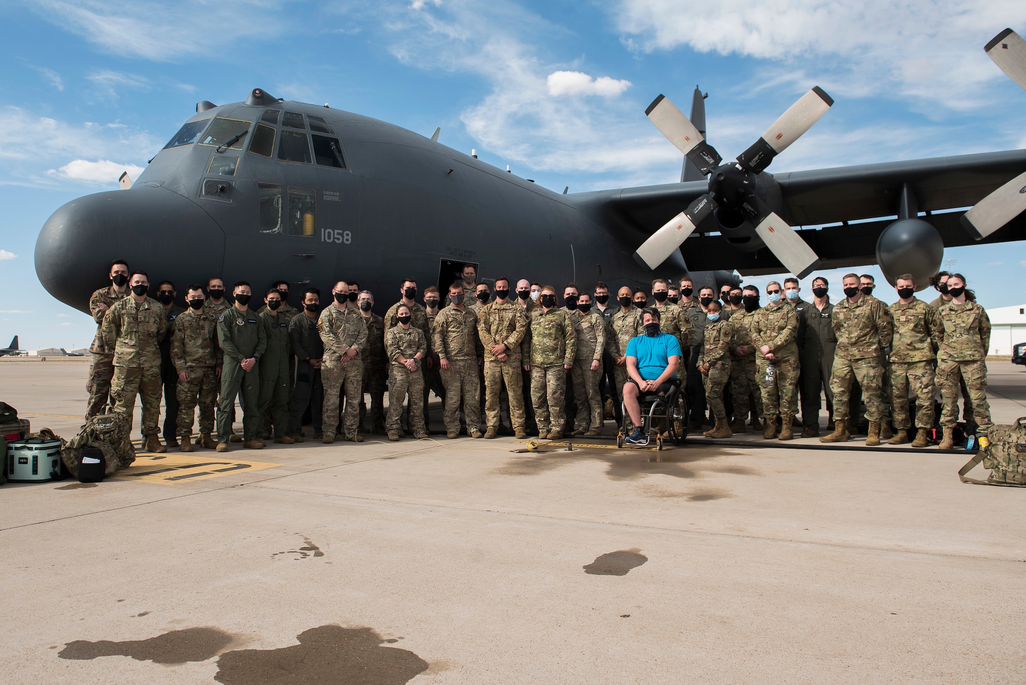 Members of the 551st Special Operations Squadron stand together for a group photo after a fini flight at Cannon Air Force Base, N.M., April 29, 2021. The 551 SOS will be standing down June 15, 2021. (U.S. Air Force photo by Senior Airman Vernon R. Walter III)